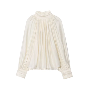 Detail of high neck pleated shirt with satin texture and elegant draped fabric