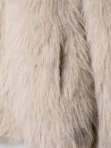 Close-up of premium faux fox fur texture in light khaki with a soft fluffy finish