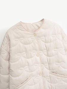 Women's chic beige quilted cotton jacket with bow-tie patterns and elegant round neck