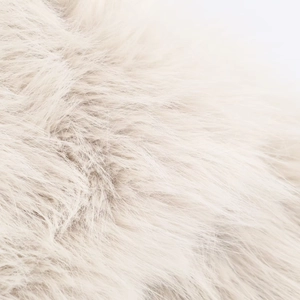 Macro detail of high-quality faux fur texture in cream showing soft fluffy fibers