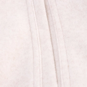 Close-up of double-stitched seams on oatmeal wool blend bomber jacket fabric