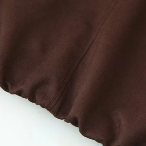 Deep brown suede jacket with standing collar and industrial double-stitch detail