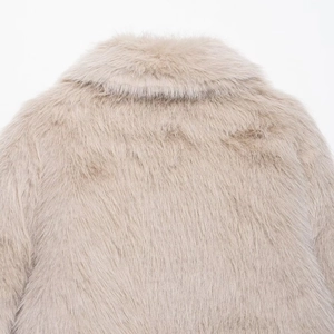 Back view of a luxury beige faux fur jacket showing high-density fiber texture and soft collar