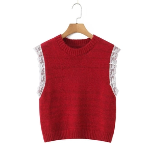Detailed view of red knitted vest featuring white lace butterfly cuffs and crew neckline