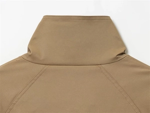 Detailed macro view of khaki trench coat high collar and shoulder double stitching detail
