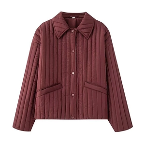 Detail of wine red quilted jacket featuring five heart-shaped buttons and turn-down collar