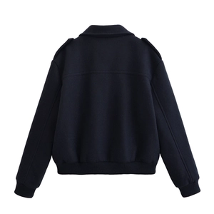 Rear view of cropped navy wool jacket with decorative epaulets and ribbed hem detailing