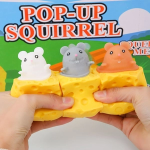 Interactive yellow cheese cup squeeze toy with pop-up squirrel for stress relief