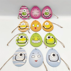 12Pcs wooden Easter egg ornaments with colorful cartoon monster faces and jute ropes