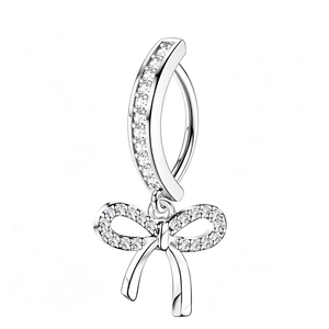Detailed close-up of butterfly navel ring with sparkling cubic zirconia on white background