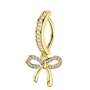 Macro detail of golden butterfly navel ring featuring sparkling inlaid zircon stones