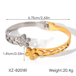 Detail view of two-tone gold and silver floral open bangle with dimensions and weight