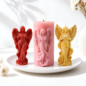 Handcrafted angel candles set in deep red, pink, and yellow wax for home decor