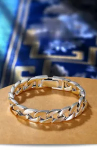 Detailed close-up of polished silver Cuban link bracelet with a secure square clasp