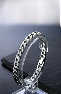 Detailed view of polished 925 silver Cuban link bracelet with a secure folding clasp