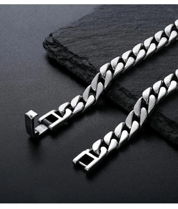 Macro shot of 925 silver Cuban link chain with a polished finish and secure square clasp