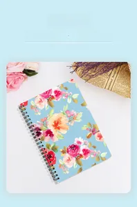 Detail of A5 spiral notebook featuring thick paper and a vintage floral cover design