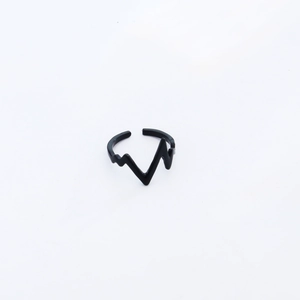 Macro shot of matte black minimalist wave ring with adjustable heart rate monitor design