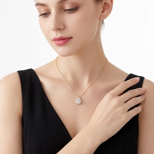 Elegant 925 silver pear-shaped moissanite pendant necklace on a gold chain