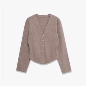 Close-up of V-neck knitted cardigan in coffee brown featuring vintage gold buttons