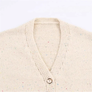 Chic beige confetti knit sweater with a V-neck and decorative cutout ribbing detail