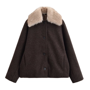 Detail of premium brown wool coat with soft beige faux fur collar and black buttons