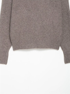 Detail view of the ribbed knit hem and cuffs on this soft brown autumn sweater for women
