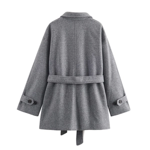 Detail view of the gray wool coat back with adjustable waist belt and textured fabric