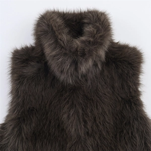 Detail of high-quality dark brown faux fur vest featuring a thick stand-up collar design