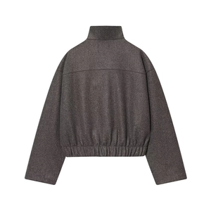Back view of a cropped wool blend jacket with stand collar and elastic hem in dark grey