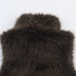 Close-up of the plush deep brown faux fox fur collar on a sleeveless winter vest