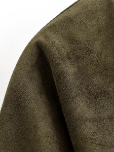 Macro detail of olive green faux suede fabric with fine matte texture for women set