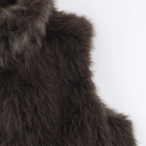 Close-up of the plush dark brown faux fur vest texture showing high-quality fiber details