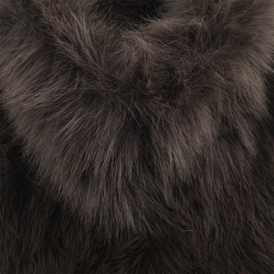 Detailed texture of thick dark brown faux fur vest showing soft and fluffy plush hair