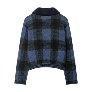 Detail view of the back of a blue and black checkered knit cardigan with a ribbed collar