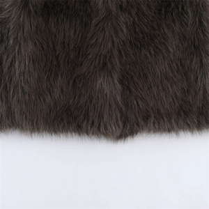 Macro detail of high-quality dark charcoal faux fur texture on a luxury sleeveless vest