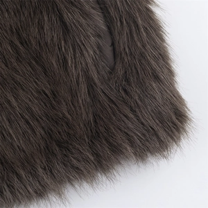 Close-up of the plush dark brown faux fur texture and lining of the sleeveless vest