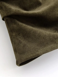 Detailed macro view of olive green suede fabric texture on autumn t-shirt set
