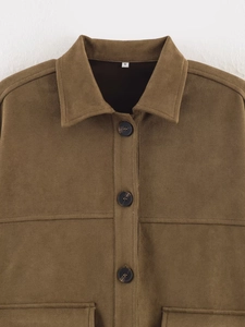 Close-up of suede texture shirt jacket with tortoise buttons and large pockets