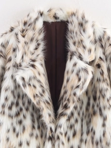 Macro view of leopard print faux fur coat collar with soft texture and silk lining