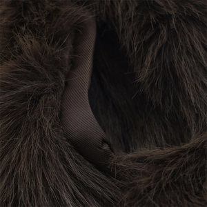 Close-up of premium dark brown faux fur vest featuring a smooth twill lining detail