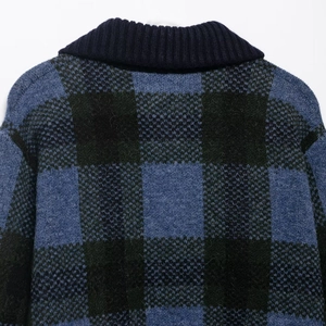 Women's plaid knit cardigan in navy blue and black featuring a fuzzy texture and ribbed collar