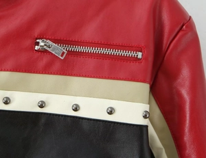Close-up of PU leather biker jacket featuring color-block design with zippers and studs