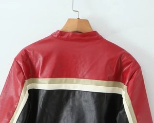 Back view of a faux leather moto jacket with red, black, and beige color blocking