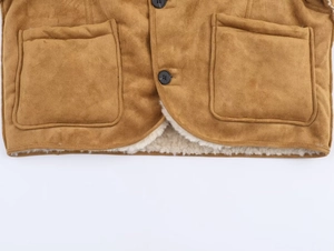 Close-up of brown suede jacket with fuzzy sheepskin lining and two large square pockets