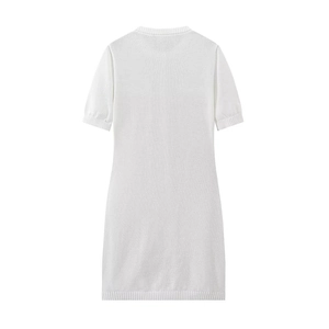 Detailed view of the ribbed edges and texture on a white knit short-sleeve dress