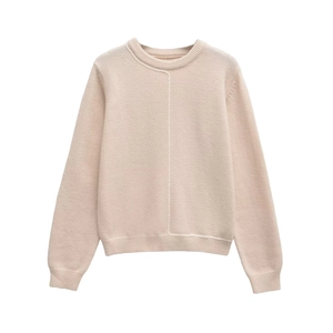 Close-up of knit sweater with contrast stitching detail and elegant round neckline