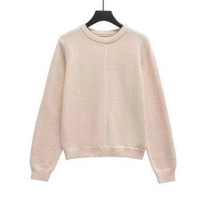 Women's crewneck knit sweater in light apricot with stylish contrast stitching detail