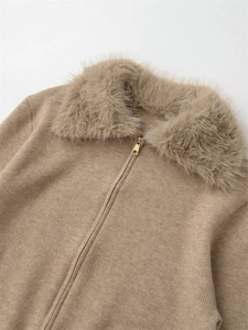 Detail of camel knit sweater with plush faux fur collar and polished gold zipper