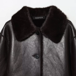 Chic black faux leather reversible jacket for women featuring a plush faux fur collar